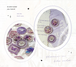 Detailed view of 3D embossed purple wax seal stickers with floral and butterfly motifs
