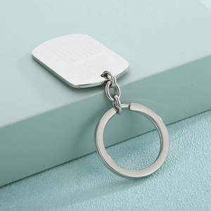 Stainless steel keychain featuring a lotus flower engraving and six-character mantra plaque
