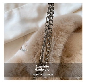 Close-up of soft plush bucket bag featuring premium silver metal chain strap detail