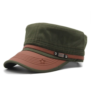 Detail of army green cadet cap with brown faux leather brim and star stitch decoration