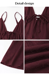Detailed close-up of wine red elegant dress featuring lace-up front and thin straps