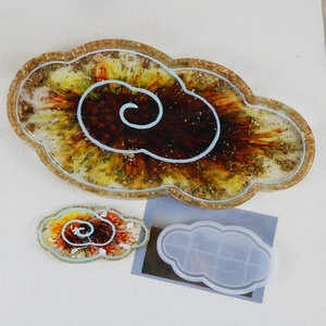 Detailed cloud-shaped silicone resin mold with finished gold foil tray display