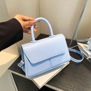 Minimalist light blue PU leather crossbody bag with top handle and adjustable strap