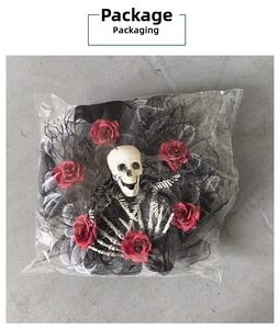 Halloween wreath with skull and red roses packaged in a transparent protective bag