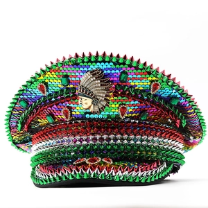 Colorful sequin captain hat with green spikes and native chief badge for festivals