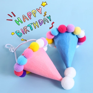 Mini felt birthday cone hats for pets with colorful pom-poms and adjustable straps
