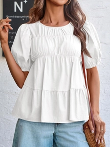 Detail of white puff sleeve doll top showing pleated ruffles and breathable fabric