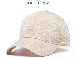 Detail of floral embroidery and breathable mesh on a beige summer baseball cap