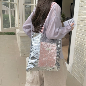 Detailed back view of a silver sequin and pink velvet tote bag with Sceahha label