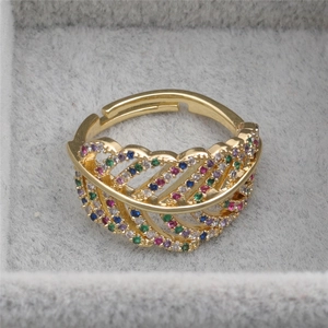 Golden feather open ring with colorful zircon inlay shown in a velvet jewelry box