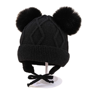 Winter knit baby hat with earflaps, rhombus patterns, and double faux fur pom-poms in black