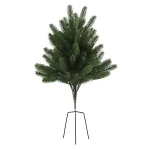 Miniature rotating music Christmas tree with dense green needles and black metal tripod base