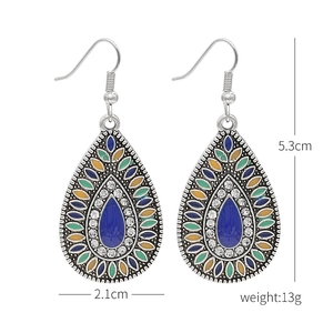 Detailed view of bohemian turquoise drop earrings with measurements 5.3cm x 2.1cm