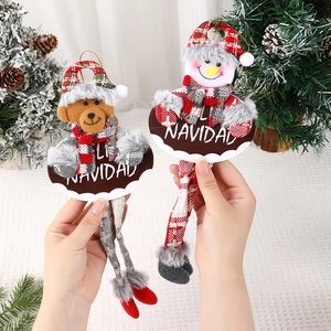 Christmas tree plush bear and snowman ornaments with Navidad wooden signs and long legs