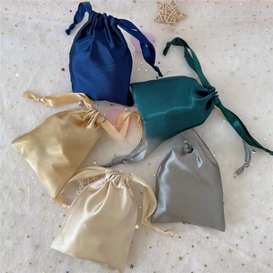 Satin drawstring bags in navy, green, gold and silver gray for gift packaging