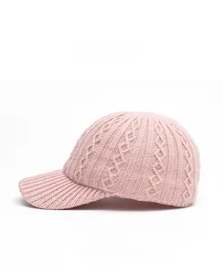 Detailed side view of pink cable knit baseball cap showing thick texture and ribbed brim