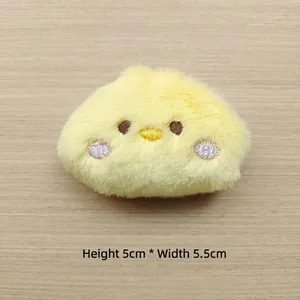 Detail of yellow plush chick doll with embroidery eyes measuring 5cm in height