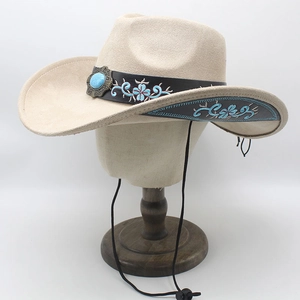 Detail of western cowboy hat with floral embroidery and turquoise stone decoration