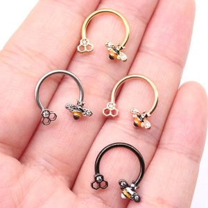 Bee and honeycomb septum rings set in gold, silver, rose gold and black stainless steel