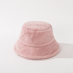 Detail of pink faux lamb wool texture on warm bucket hat with thick plush finish