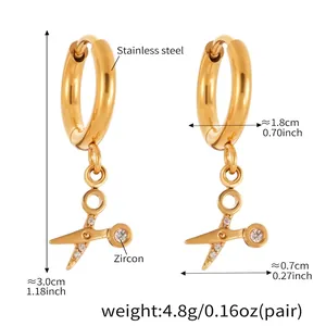 Detailed view of 18k gold-plated scissor earrings with zircon stones and dimensions