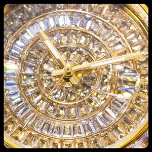Macro shot of gold-plated square watch dial with full crystal inlay and date window