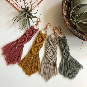 Handmade macrame tassel keychains in four earth tones with rose gold lobster clasps