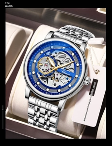 Macro shot of silver automatic mechanical watch with hollow blue dial in a leather box