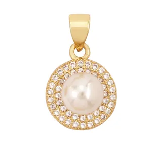 Macro view of gold heart pendant with white faux pearl and micro-paved cubic zirconia