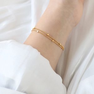 Double-layered 18K gold plated titanium steel star square bracelet for women on white silk