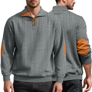 Detail of grey cable-knit Henley sweater with orange elbow patches and buttoned collar