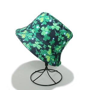 Saint Patrick's Day bucket hat with green clover print on dark fabric for women