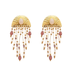 Golden semi-circle textured earrings with colorful bead tassels and white oval gemstones