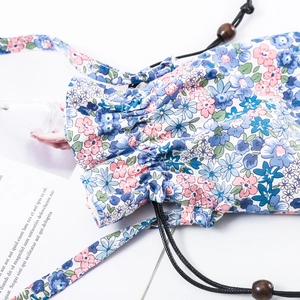 Floral drawstring mobile phone crossbody bag with pink flowers and wooden beads
