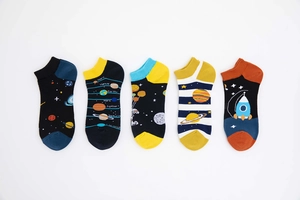 Detail view of five assorted space-themed ankle socks featuring planets and astronauts