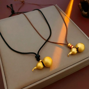 Elegant gold matte gourd pendant necklace with minimalist woven cord for women