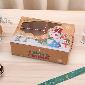 Detail of Christmas kraft paper gift box with a transparent window and red cotton rope