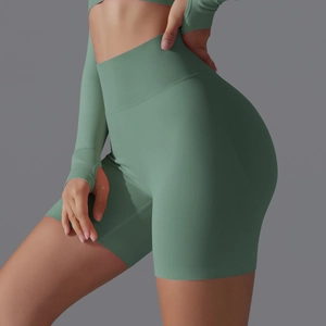 Detail of high-waist seamless yoga shorts with ribbed waistband and thumbhole sleeves