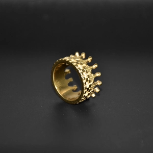 Elegant 18k gold plated crown ring for women displayed on a black textured background