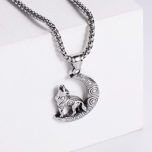 Detailed close-up of a silver Viking wolf howling at the moon stainless steel pendant