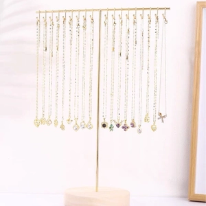 Gold iron necklace display stand organizer showcasing multiple assorted zircon pendants
