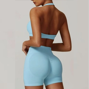 Detailed back view of light blue halter neck sports bra and high waist ribbed yoga shorts
