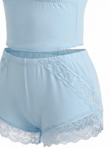 Close-up of baby blue lace lingerie set with floral lace trim and soft cotton fabric