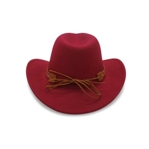 Detail of red wool felt cowboy hat featuring a brown decorative band with a small bow knot