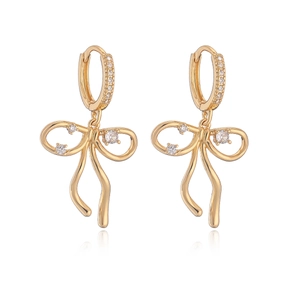 Elegant gold plated bow earrings with sparkling cubic zirconia on white background