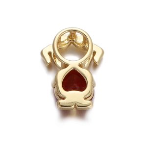 Detailed view of girl pendant with heart red zircon and gold plated metal finish