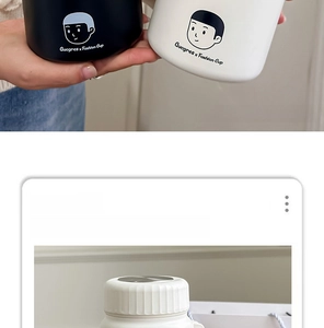 Detail of matte finish insulated tumblers with cartoon print and metal lids