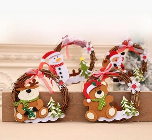 Close-up of rustic Christmas vine wreaths with reindeer, snowman, and Santa characters