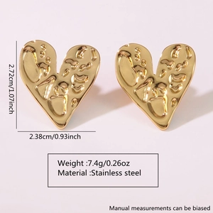 Detailed view of textured gold heart earrings in stainless steel with size measurements