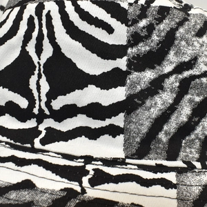 Close-up of zebra print bucket hat featuring high-quality cotton fabric and stitched seams